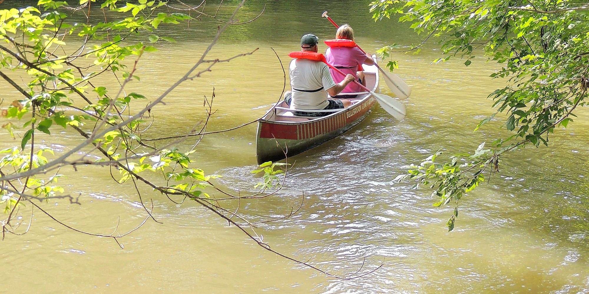 two people canoeing