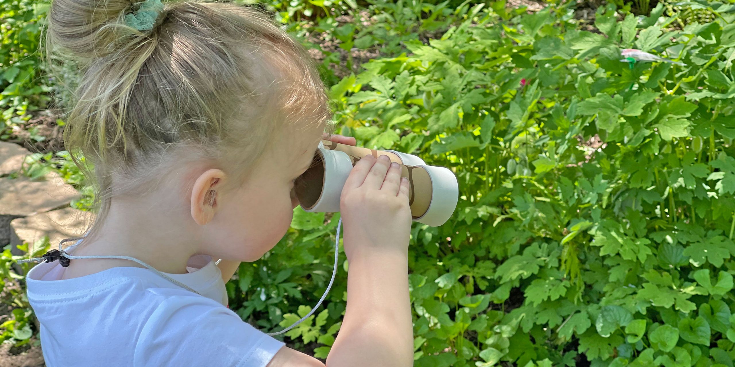 Little girl with binoculars
